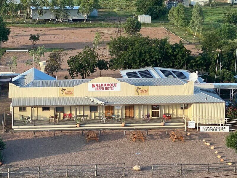 Three wooden tables outside Crocodile Dundee's Walkabout Creek Hotel, McKinlay QLD