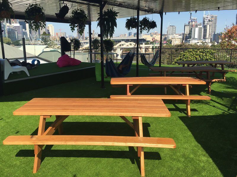 Tables on a rooftop at a backpackers in Brisbane CBD
