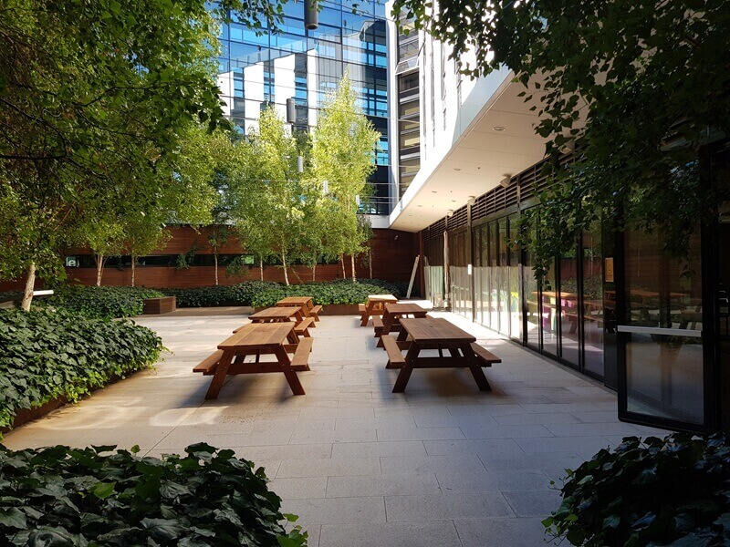 Courtyard seating between high-rise buildings in Sydney